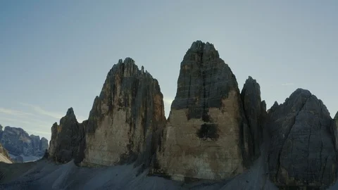 View of the Three Peaks  of Lavaredo Mountains Rainbow sunrays Stock Footage 128952230