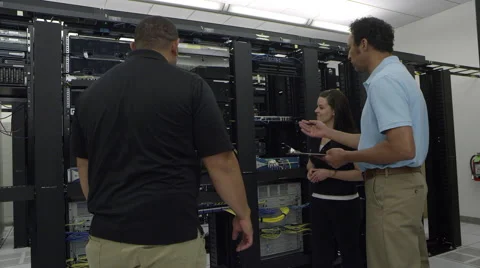 View of three people discussing hardware Stock Footage 64521789