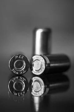 View of three pistol bullets in black and white Stock Photos