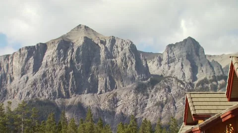 View of three sisters and mountain lodge in Canmore Stock Footage 54592868
