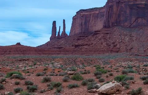 View of the Three Sisters red rocks In Monument Valley, Navajo Nation,  Ari.. Stock Photos