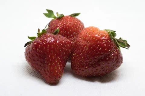 View of Three Strawberries Stock Photos