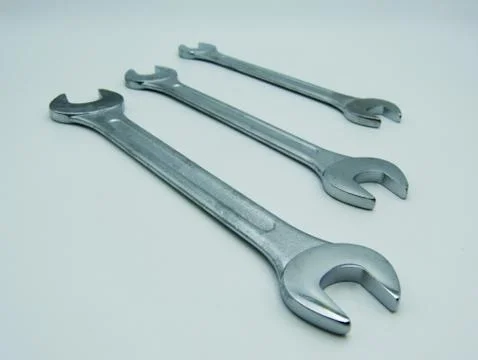 View of three wrenches against white background Stock Photos