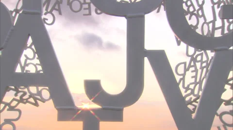 View Through Abstract Alphabet Statue with Sun Flare Vídeo Stock 39468971