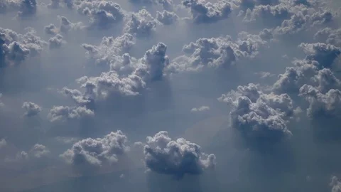 View through aircraft window on cloudscape at sunrise hours. 4k UHD Vídeo Stock 70277118