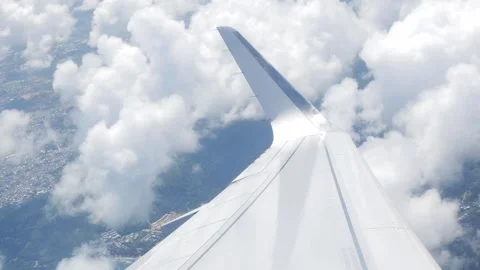 View through airplane aircraft window with wing view flying making a turn i.. Stock Footage 279215161