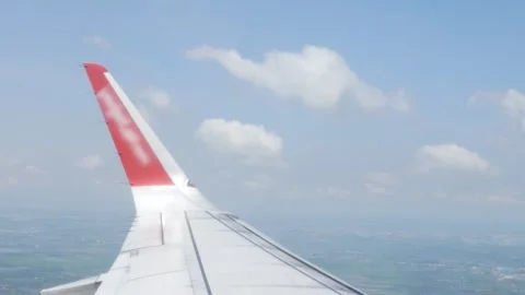 View through airplane aircraft window with wing view flying making a turn i.. Stock Footage 279444789