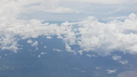 View through airplane aircraft window while flying over cloud in sky over s.. Stock Footage 285298707