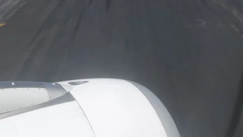View through airplane aircraft window with jet engine while taxing on taxi .. Stock-Footage 286314785