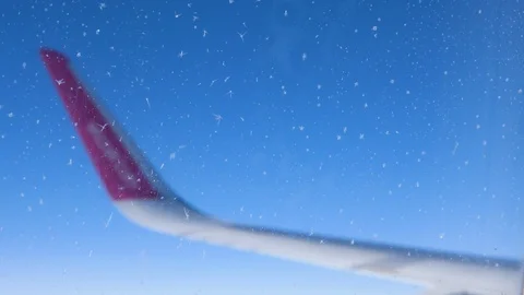 View through Airplane frosty window. Aircraft wing sky. Focus on window Stock Footage 112808554
