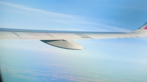 View through an Airplane window. Aircraft wing sky and land 스톡 동영상 112799038