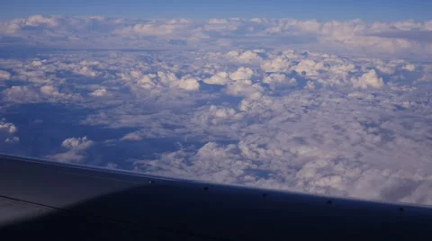 View through an Airplane Window in the Blue Sky in Clouds 库存影片 68769946