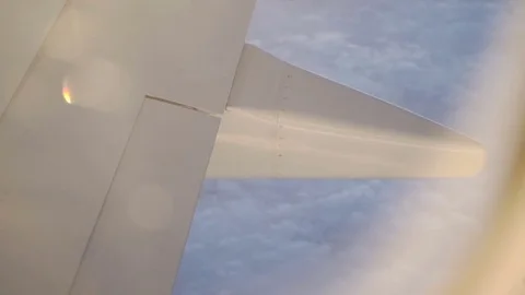 View Through Airplane Window At Golden Hour Stock Footage 83598452