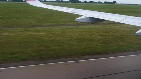 View through an Airplane window. Plane taking off from airport runaway 스톡 동영상 112818018