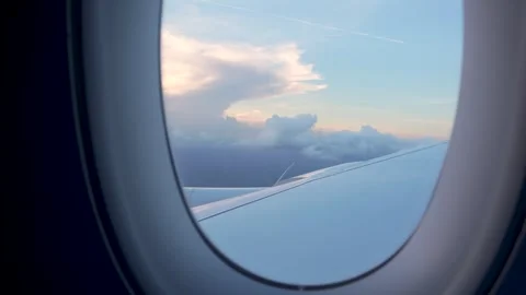 View Through Airplane Window Sunset Sky Fluffy Clouds Wing Stock Footage 280225544