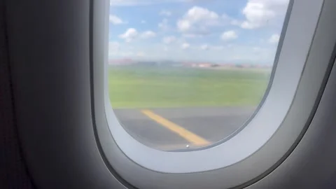 View Through Airplane Window While Taxiing on the Runway Stock Footage 305955133