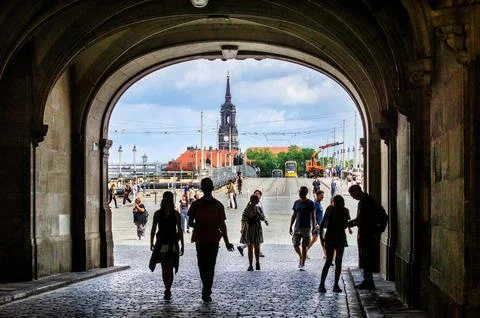 View through arch with stone warriors towards Augustus Bridge in Dresden 库存照片