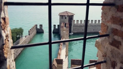 View Through A Barred Window To A Medieval Fortification On The Water Stock Footage 167606698