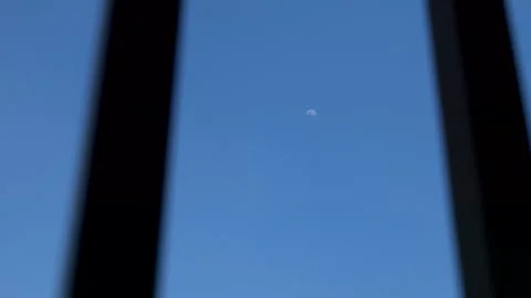 View through the bars of a half moon in sunny day. Video 4K 库存影片 320530234