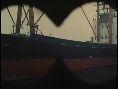View through binoculars looking at ship Stock Footage 260249174