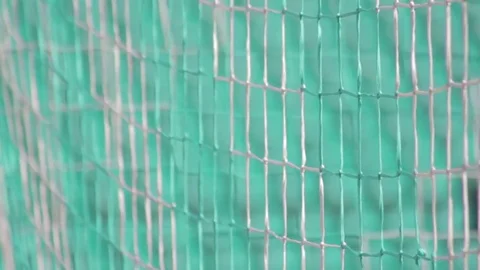 View through blurred goal net to stadium seats Stock Footage 73591097