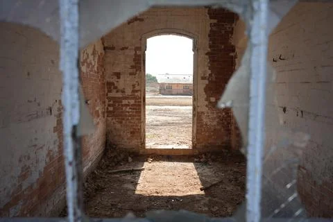 View Through Broken Window Of Abandoned Brick Building Bulcote Nottinghamshire Stock Photos