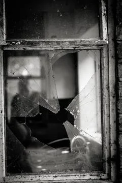 A View Through A Broken Window In A Derelict Building Stock Photos
