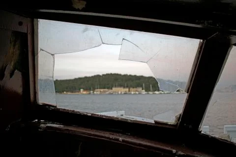 View through a broken window of an old ship Stock Photos