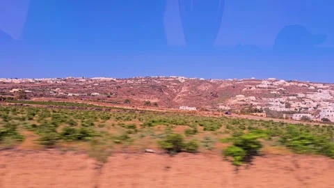 View Through Bus Window While Driving Across Santorini Island In Greece With Stockbeeldmateriaal 334538647