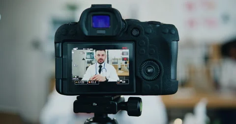 View through the camera on attractive successful experienced bearded doctor Stock Footage 159788906