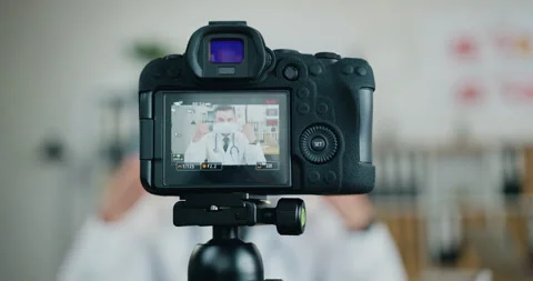 View through camera on confident high-skilled modern bearded doctor which Stock Footage 159795928