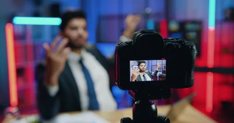View through camera sight on likable confident expereinced smart stylish bearded Stock Footage 166614347