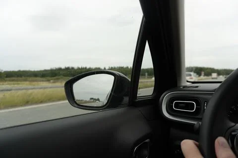 View Through Car Side Mirror on a Highway Foto stock