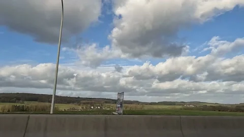 View through car window of car driving on highway, landscape sliding by 스톡 동영상 171619173