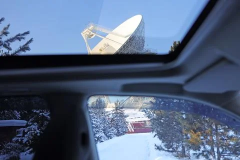 View through the car windows to the telescope in winter on a clear day Stock Photos