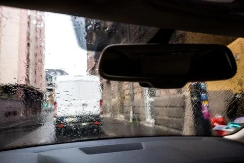 View through car windshield with rain drops on fall day in Paris Stock Photos