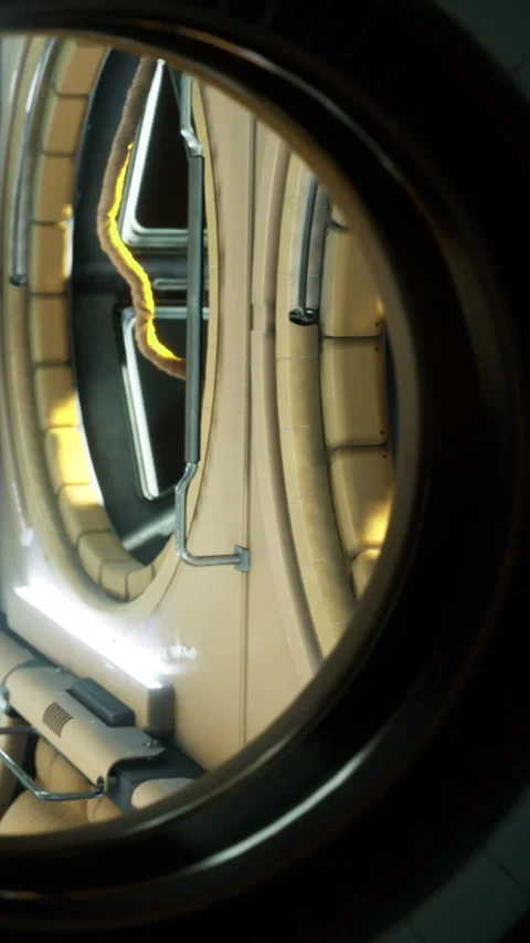 View through a circular window in a futuristic hallway with glowing lights Stock Footage 336573378