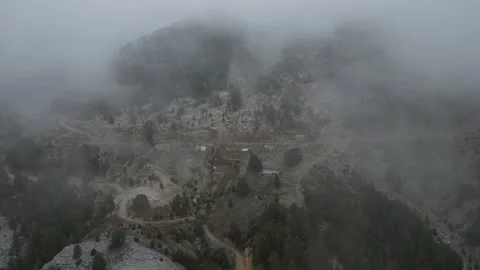 View through the clouds of an abandoned mountain settlement 動画素材 231028100