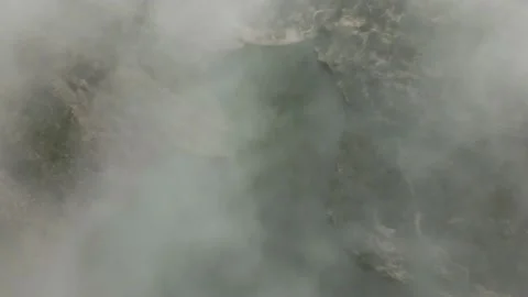 View through the clouds to the dam and reservoir Stock Footage 239942438