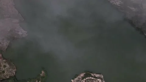 View through the clouds to the reservoir Stock Footage 239942269