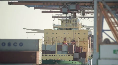 View Through Containers Loading Containers On A Cargo Ship Stock Footage 57238149