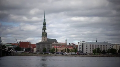 View through the Daugava River of Saint Peter's Church against the background of Stock Footage