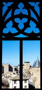 View through decorative window frame with historic buildings Stock-Fotos