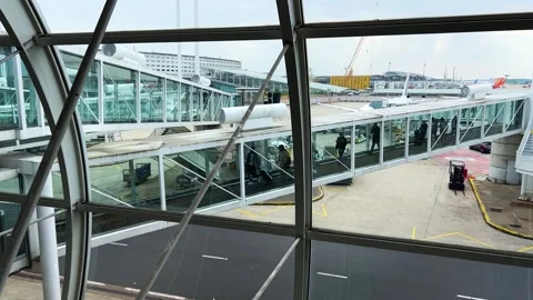 View through the departure hall windows of passengers arriving in Paris. Video stock 311950103