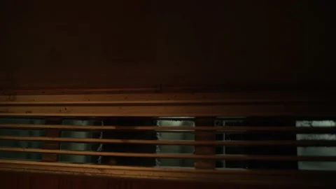 View through the dirty, old metal lattice of the elevator to the lamps in shaft Stock Footage 154697262