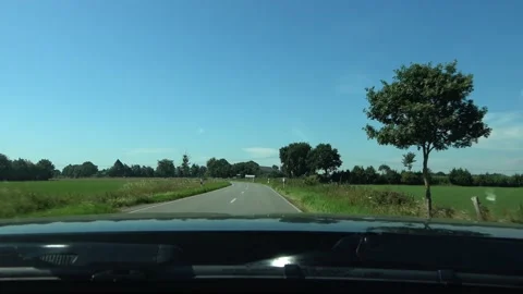 View through a front window  of a black sportscar driving on a european country  Stock Footage 136827741