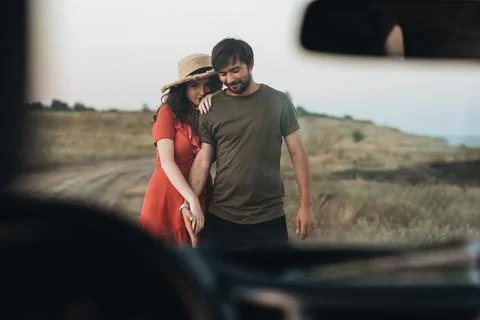 View Through Front Window of Car, Young Couple Man and Woman Having Fun Time Stock Photos