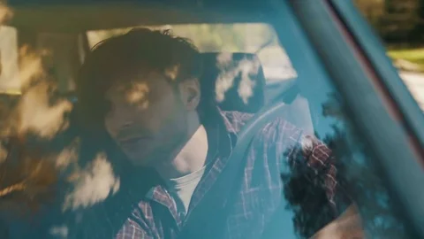 View through the front windshield of a careless driver who's eating snacks Stock Footage 83223167