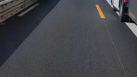 View through the front windshield window onto asphalt road with traffic Stock-Footage 305506478