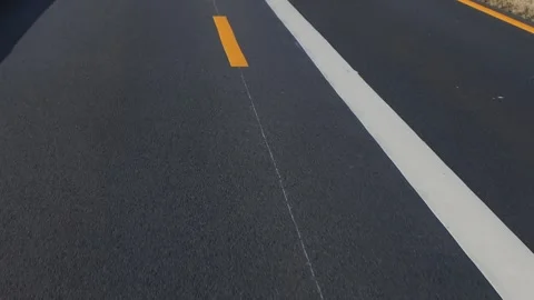 View through the front windshield window onto asphalt road with traffic Video stock 305506494